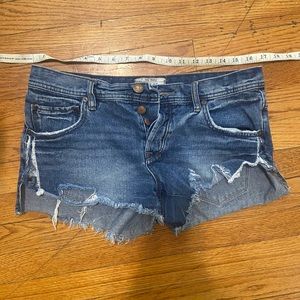 Free People distressed jean booty shorts